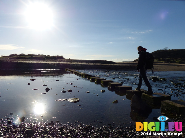 FZ010101 Pepijn crossing stepping stones at Three Cliffs Bay